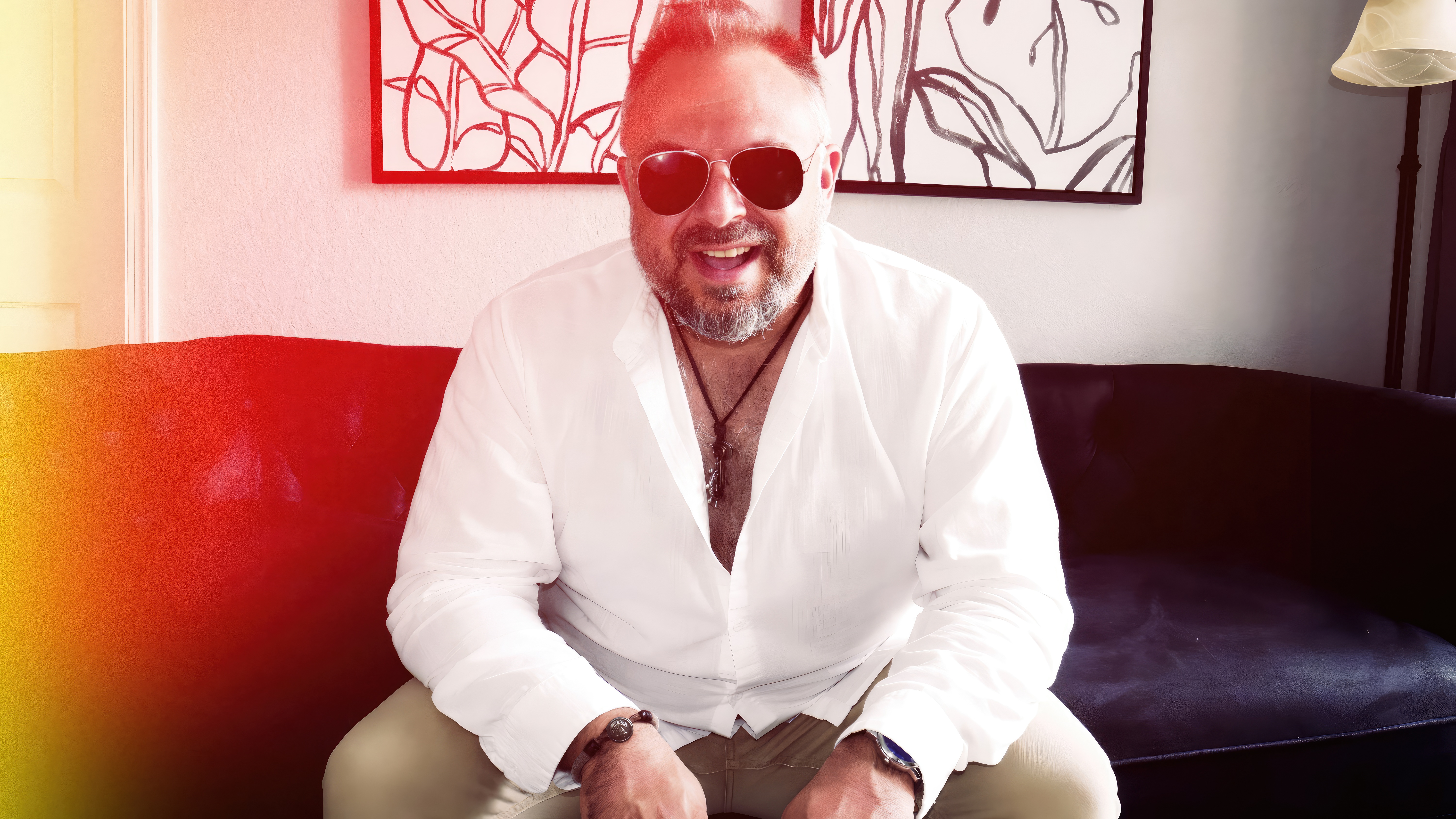 Brad Brock smiling in sunglasses and a white shirt